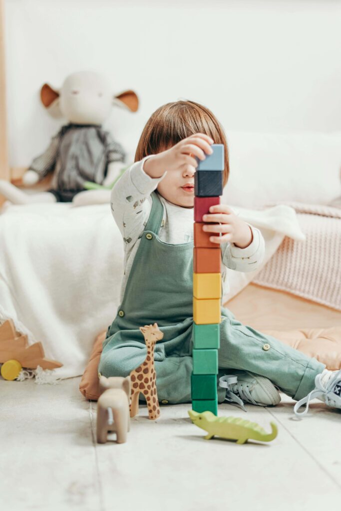 child stacking blocks