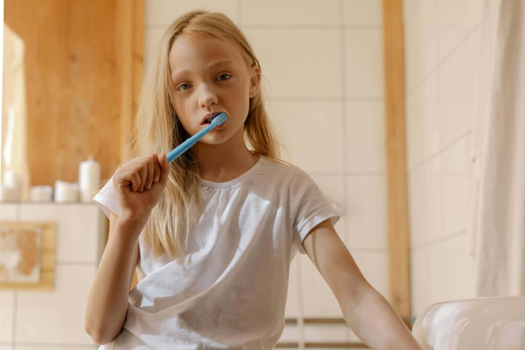 girl brushing teeth